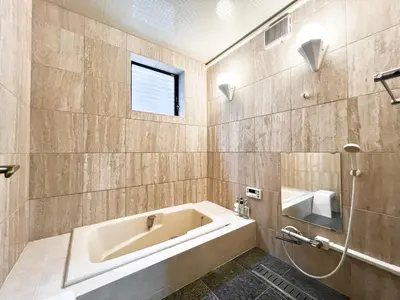 a bathroom with a large tub and a window at Hanegi House -SE0417 in Tokyo