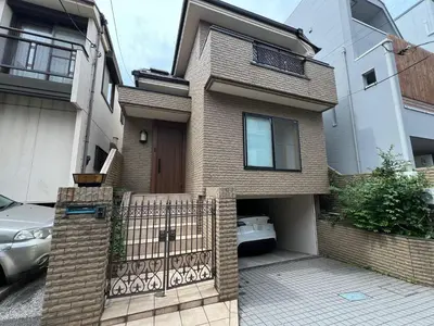 a brick house with a gate in front of it at Hanegi House -SE0417 in Tokyo