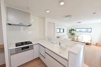 a white kitchen with a stove and a sink at 小春日和-東新宿獨立包棟/車站3分鐘＿玥澄館 in Tokyo