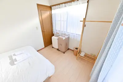a hospital room with a bed and a window at Private Villa Sinjuku -7min to \u9ad8\u7530\u99ac\u5834\u99c5 in Tokyo