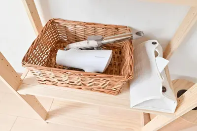 a basket with a roll of toilet paper on a shelf at Private Villa Sinjuku -7min to \u9ad8\u7530\u99ac\u5834\u99c5 in Tokyo