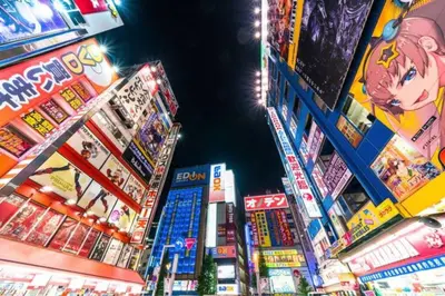 a group of buildings in a city at night at \u30a2\u30f3\u30c9\u30b9\u30c6\u30a4\u5e61\u30f6\u8c37202 in Tokyo
