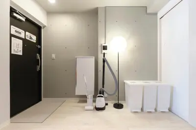 a room with a floor lamp next to a door at Blighton Miyoshi by Tranova in Tokyo