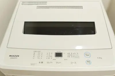 a white washing machine with a window on top at J-ARC Akebonobashi by Tranova in Tokyo