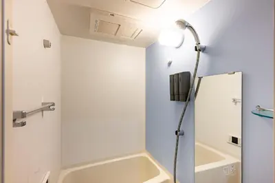 a bathroom with a shower and a sink at \u30c6\u30e9\u30b9\u5e73\u4e95 in Tokyo