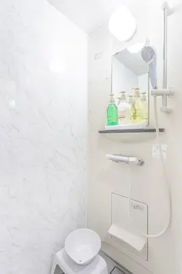 a white bathroom with a toilet and a sink at Residence Stay Hanzomon - \u30ec\u30b8\u30c7\u30f3\u30b9\u30b9\u30c6\u30a3\u534a\u8535\u9580 in Tokyo