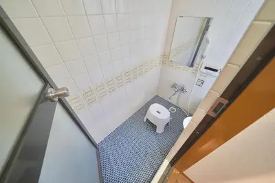 a small bathroom with a toilet in a stall at TOMARIE Residential Suite Higashi-Tateishi in Tokyo