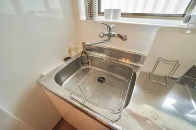 a kitchen sink with a strainer in it at TOMARIE Residential Suite Higashi-Tateishi in Tokyo