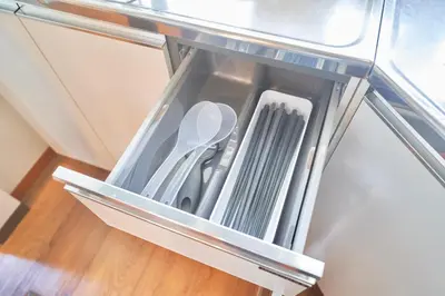 an open refrigerator drawer with utensils in it at TOMARIE Residential Suite Higashi-Tateishi in Tokyo