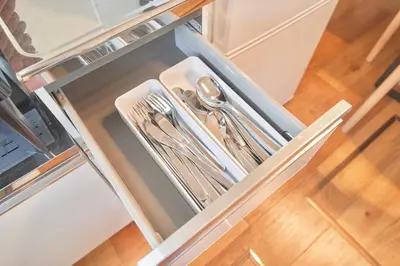 a drawer in a refrigerator filled with silver utensils at TOMARIE Residential Suite Higashi-Tateishi in Tokyo