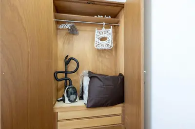 a cabinet with a telephone and a bag in it at DeLCCS\u9ad8\u5186\u5bfa in Tokyo