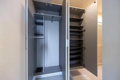 a walk in closet with a glass door and stairs at DeLCCS\u9ad8\u5186\u5bfa in Tokyo