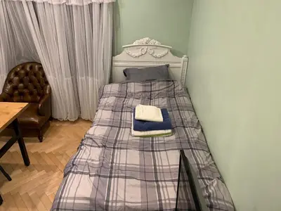 a bed with a blanket on it in a room at \u30b6\u30b9\u30bf\u30f3\u30c0\u30fc\u30c9\u30a2\u30d1\u30fc\u30c8\u30e1\u30f3\u30c8\u6e0b\u8c37\u7b39\u585aRoom A in Tokyo