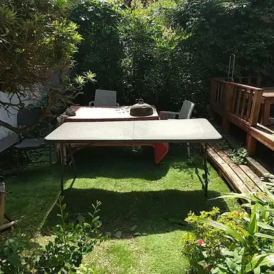 a picnic table in a yard with grass and a bench at \u30b6\u30b9\u30bf\u30f3\u30c0\u30fc\u30c9\u30a2\u30d1\u30fc\u30c8\u30e1\u30f3\u30c8\u6e0b\u8c37\u7b39\u585aRoom A in Tokyo