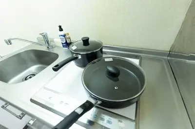 a pot sitting on a counter next to a sink at shinjuku, tokyo city hall, apartment, Hotel for Max 6 person in Tokyo