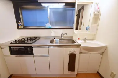 a small kitchen with a sink and a stove at Shinozaki Kodate - Vacation STAY 16392 in Tokyo