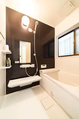 a bathroom with a shower and a tub and a sink at 58, Higashi-Horikiri 2, private house rental, \u6771\u5800\u52072 in Tokyo