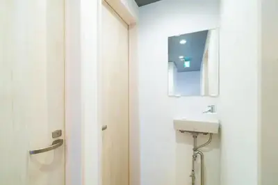 a bathroom with a sink and a mirror at 58, Higashi-Horikiri 2, private house rental, \u6771\u5800\u52072 in Tokyo