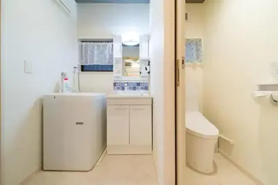 a small bathroom with a sink and a toilet at 58, Higashi-Horikiri 2, private house rental, \u6771\u5800\u52072 in Tokyo