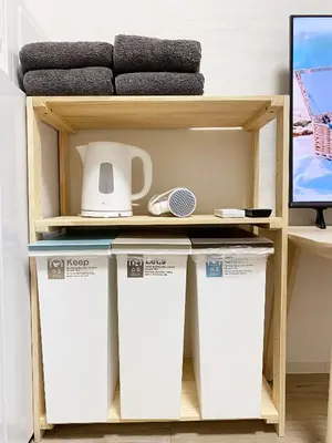 a shelf with three containers in a room at The Lions in Tokyo