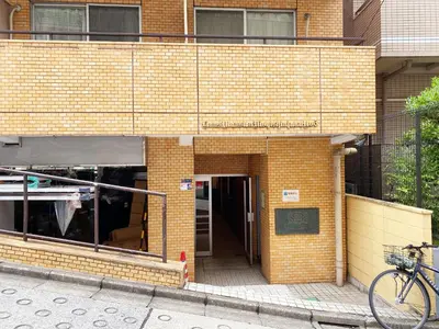 a bike parked outside of a brick building at The Lions in Tokyo