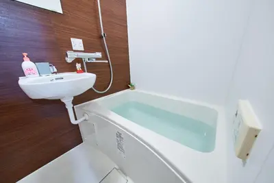 a bathroom with a sink and a bath tub at Shinjuku 102 Private Stay Near Park and Station with Free WiFi in Tokyo