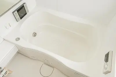 a white tub in a bathroom with a sink at self-check in-\u5927\u585a\u99c5One minute in Tokyo