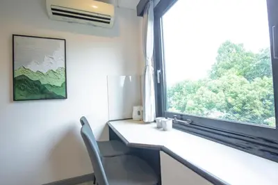 a room with a desk and a window with a chair at HOTEL TOKYO JOURNEY PORTAL KINSHICHO I Self Check-in Check-out Minutes from Sumiyoshi Station & Iconic Attractions & Sky Tree in Tokyo