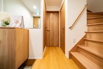 a hallway with wooden stairs in a house at 89, Yahiro 1, Detached House for Rent, \u516b\u5e831 in Tokyo