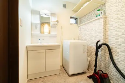 a small bathroom with a sink and a refrigerator at 89, Yahiro 1, Detached House for Rent, \u516b\u5e831 in Tokyo