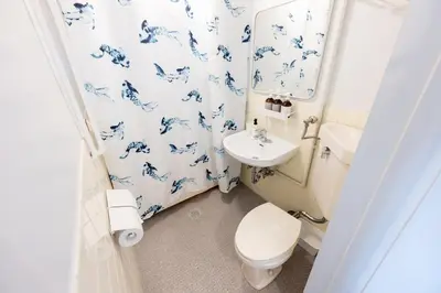 a bathroom with a toilet and a sink at chano-ma in Tokyo