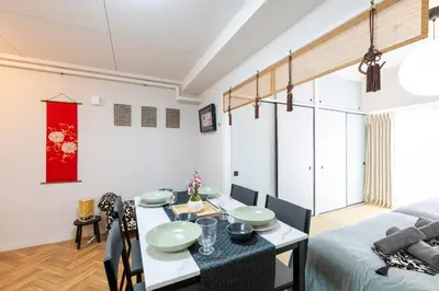 a dining room and living room with a table and chairs at chano-ma in Tokyo