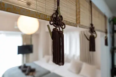 a group of ties hanging from the ceiling in a room at chano-ma in Tokyo