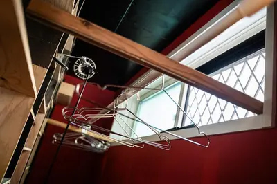 a metal object hanging from a ceiling next to a window at Lab8 Tokyo - Creative Coliving & Group Stay 6 Minutes to Shibuya Stay Play & Connect in Tokyo