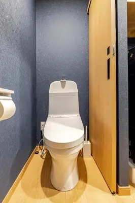 a bathroom with a white toilet in a room at \u65b0\u5bbf6 Home in Tokyo
