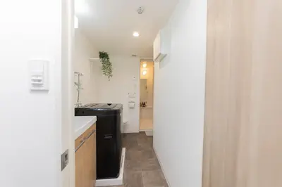 a small kitchen with a sink and a stove at FL Residence Shinjuku Gyoen V in Tokyo