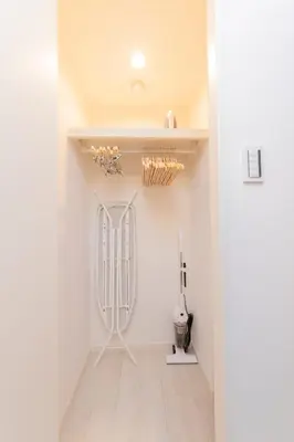 a room with a white wall with a baseball bat at FL Residence Shinjuku Gyoen V in Tokyo