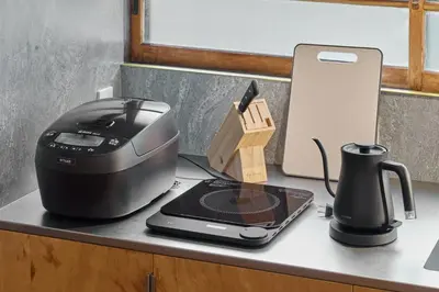 a printer sitting on a counter next to a coffee maker at Pufuka Wakakusa \u3077\u3075\u304b\u82e5\u8349 in Tokyo