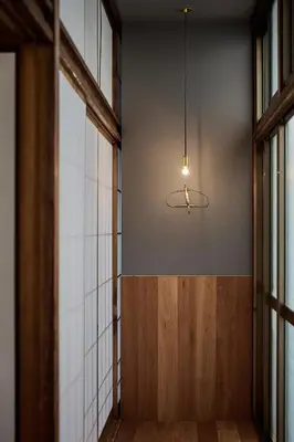 a hallway with a light hanging from a wall at Pufuka Wakakusa \u3077\u3075\u304b\u82e5\u8349 in Tokyo