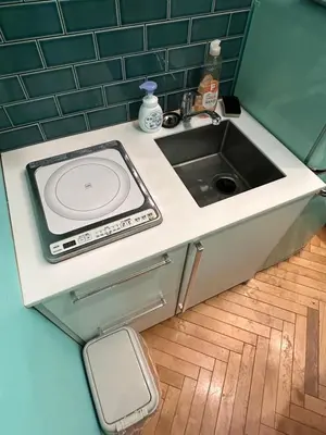 a kitchen counter with a sink and a toilet at \u30b6\u30b9\u30bf\u30f3\u30c0\u30fc\u30c9\u30a2\u30d1\u30fc\u30c8\u30e1\u30f3\u30c8\u6e0b\u8c37\u7b39\u585ac in Tokyo