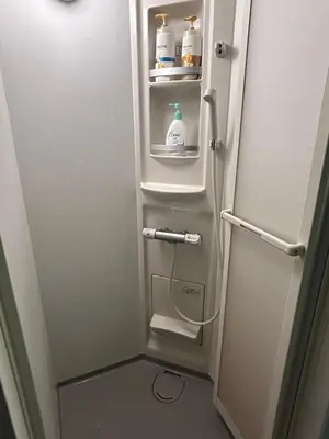 a refrigerator with its door open in a bathroom at \u30b6\u30b9\u30bf\u30f3\u30c0\u30fc\u30c9\u30a2\u30d1\u30fc\u30c8\u30e1\u30f3\u30c8\u6e0b\u8c37\u7b39\u585ac in Tokyo