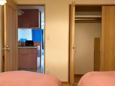 a room with a kitchen and a door leading to a bedroom at Lapis House 201 - 2F & 3F in Tokyo
