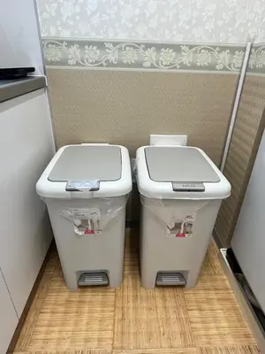 two trash cans sitting next to each other in a kitchen at DainHostel2 in Tokyo