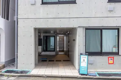 a hallway of a building with the door open at \u30b8\u30a7\u30df\u30cb\u30b9\u6c60\u888b303 in Tokyo