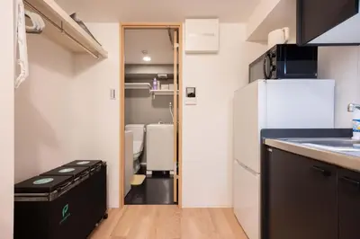 a small kitchen with a refrigerator and a sink at \u30b8\u30a7\u30df\u30cb\u30b9\u6c60\u888b203 in Tokyo