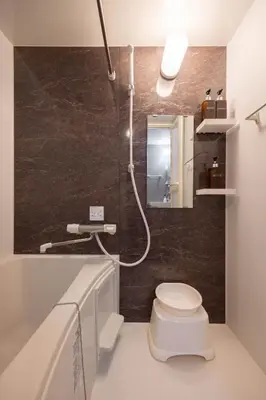 a bathroom with a white toilet and a shower at \u30b8\u30a7\u30df\u30cb\u30b9\u6c60\u888b203 in Tokyo