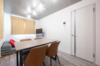 a dining room with a table and chairs at ARUCiA\u99d2\u6ca2\u5927\u5b66 in Tokyo