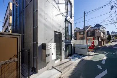 a building on the side of a street at ARUCiA\u99d2\u6ca2\u5927\u5b66 in Tokyo