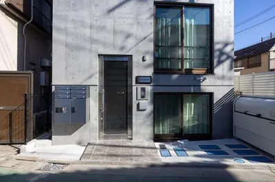 a building with a door on the side of it at ARUCiA\u99d2\u6ca2\u5927\u5b66 in Tokyo
