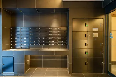 a walk in closet with glass doors and cabinets at Galicia Otsuka in Tokyo